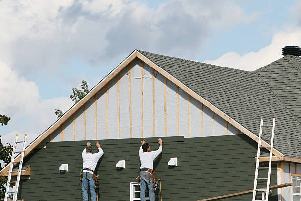 Professional Siding Replacement technician working in Harrisburg, NC